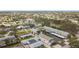 Bird's-eye view of the property showcases its prime location amidst mature trees and beautiful neighborhood at 516 Parkdale Mews # 516, Venice, FL 34285