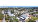 Aerial view of a condo complex with mature landscaping, covered parking and city views at 516 Parkdale Mews # 516, Venice, FL 34285