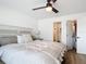 Bright bedroom with bed, ceiling fan, wood floor, and closet at 516 Parkdale Mews # 516, Venice, FL 34285