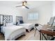 Bright bedroom showcases two twin beds, a desk, and natural light, offering a cozy retreat at 516 Parkdale Mews # 516, Venice, FL 34285