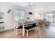Inviting dining space offers a dining table set with seating and an airy living room in the background at 516 Parkdale Mews # 516, Venice, FL 34285