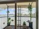 Enclosed patio with plants and ladder decor at 516 Parkdale Mews # 516, Venice, FL 34285