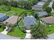 This aerial view shows the backyard pool, fenced yard, and house location in a peaceful neighborhood at 5419 Lakehurst Ct, Palmetto, FL 34221