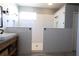 Modern bathroom featuring a large, divided shower with white subway tile and glass partitions at 5419 Lakehurst Ct, Palmetto, FL 34221