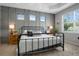 Stylish bedroom with a decorative accent wall, a large window, and neutral tones creating a relaxing atmosphere at 5419 Lakehurst Ct, Palmetto, FL 34221