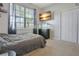 Cozy bedroom featuring a large window with natural light, a tv, and a double door closet at 5419 Lakehurst Ct, Palmetto, FL 34221