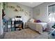 Bright bedroom decorated with personal touches including floating shelves, wall art, and fun decor at 5419 Lakehurst Ct, Palmetto, FL 34221