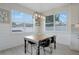 Cozy dining area featuring a rustic table, ample natural light, and modern decor at 5419 Lakehurst Ct, Palmetto, FL 34221