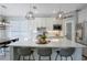 Bright kitchen with a large island, modern lighting, stainless steel appliances, and ample counter space at 5419 Lakehurst Ct, Palmetto, FL 34221