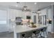 Bright, modern kitchen with a central island, pendant lighting, stainless steel appliances, and open layout at 5419 Lakehurst Ct, Palmetto, FL 34221