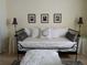 Comfortable bedroom with a daybed, decorative cushions, and side tables with lamps at 5449 Downham Mdws, Sarasota, FL 34235