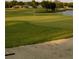 Beautiful golf course featuring lush green grass and a serene lake at 5449 Downham Mdws, Sarasota, FL 34235