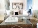 Inviting living room featuring stylish furniture, a glass coffee table, and neutral tones at 5449 Downham Mdws, Sarasota, FL 34235