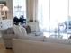 Bright living room with comfortable seating, stylish decor, and sliding glass door to patio at 5449 Downham Mdws, Sarasota, FL 34235
