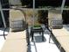 Relaxing poolside lounge chairs and pillow, ideal for unwinding at 5449 Downham Mdws, Sarasota, FL 34235