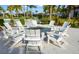 Community fire pit with seating, offering a cozy outdoor gathering spot among landscaped grounds at 5750 Long Shore Loop, Sarasota, FL 34238