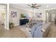 Cozy living room with neutral walls, beach themed decorations, and a large blue entertainment center at 5750 Long Shore Loop, Sarasota, FL 34238