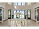 Clubhouse lobby with an enormous round table centerpiece and views of the grounds at 5750 Long Shore Loop, Sarasota, FL 34238