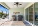 Outdoor kitchen with built in grills and bar, perfect for backyard entertaining at 5750 Long Shore Loop, Sarasota, FL 34238