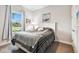 Comfortable bedroom featuring a large window and street view at 5802 Alabaster Stone Ln, Apollo Beach, FL 33572