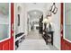 Inviting entryway featuring a long hallway, stylish decor, and modern flooring at 5802 Alabaster Stone Ln, Apollo Beach, FL 33572