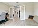 Bright office space features light wood floors, glass paned doors, and natural light at 5802 Alabaster Stone Ln, Apollo Beach, FL 33572