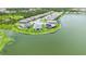 Beautiful lakefront property with a fenced backyard, lush grass, and stunning water views at 5910 Hevena Ct, Palmetto, FL 34221