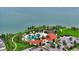 Stunning aerial view of the community pool and clubhouse with lakefront access at 5910 Hevena Ct, Palmetto, FL 34221