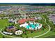 Stunning aerial view of the community showcasing pools, playgrounds, and lush landscaping at 5910 Hevena Ct, Palmetto, FL 34221