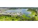 Stunning lakefront home with lush landscaping and community views in a desirable neighborhood at 5910 Hevena Ct, Palmetto, FL 34221