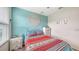 This bedroom offers a peaceful retreat with a comfortable bed, soft decor, and serene atmosphere at 5910 Hevena Ct, Palmetto, FL 34221