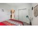 Bedroom featuring closet with doors and modern decor at 5910 Hevena Ct, Palmetto, FL 34221