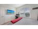 This bedroom features a large window for natural light, workspace, and entertainment options at 5910 Hevena Ct, Palmetto, FL 34221