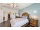 Inviting bedroom with hardwood floors, ample natural light, and stylish decor at 5910 Hevena Ct, Palmetto, FL 34221