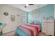 Bright bedroom boasts colorful decor, comfortable furnishings, and ample natural light at 5910 Hevena Ct, Palmetto, FL 34221