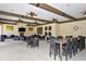 This clubhouse boasts ceiling fans, a fireplace, television, tables, and seating for a social atmosphere at 5910 Hevena Ct, Palmetto, FL 34221