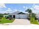 Beautiful single-story home with a two-car garage, paver driveway, and well-manicured landscaping at 5910 Hevena Ct, Palmetto, FL 34221