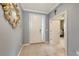 Welcoming entryway features neutral walls, tile flooring, and an ornate mirror with access to an office at 5910 Hevena Ct, Palmetto, FL 34221