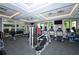 Bright gym featuring modern exercise equipment, mirrored walls, and natural light for a refreshing workout space at 5910 Hevena Ct, Palmetto, FL 34221