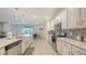Bright kitchen featuring stainless steel appliances, a breakfast bar, ample counter space and tile floors at 5910 Hevena Ct, Palmetto, FL 34221