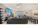 Bright living room features tiled floors, a large sectional sofa, and a large television at 5910 Hevena Ct, Palmetto, FL 34221
