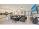Spacious living room with an open floor plan to the kitchen featuring a breakfast bar at 5910 Hevena Ct, Palmetto, FL 34221