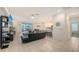 Open-concept living room features a large sectional sofa and a kitchen island with bar stool seating at 5910 Hevena Ct, Palmetto, FL 34221
