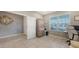 Functional home office with tile flooring, neutral walls, and a large window for natural light at 5910 Hevena Ct, Palmetto, FL 34221