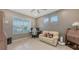 Cozy home office includes a comfortable sofa, desk, and ample natural light from the window at 5910 Hevena Ct, Palmetto, FL 34221