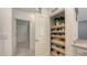 Walk-in pantry with shelving for organized storage in this well-maintained home at 5910 Hevena Ct, Palmetto, FL 34221