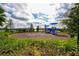 Community playground with swings and slides overlooking the lake at 5910 Hevena Ct, Palmetto, FL 34221