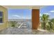 Relaxing balcony overlooking waterfront views, complete with tile flooring and metal railings at 610 Riviera Dunes Way # 306, Palmetto, FL 34221