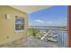 Enjoy beautiful marina views from this spacious tiled balcony with white metal railings at 610 Riviera Dunes Way # 306, Palmetto, FL 34221