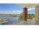 Relaxing balcony overlooking waterfront views, complete with tile flooring and metal railings at 610 Riviera Dunes Way # 306, Palmetto, FL 34221